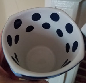 Inside of the square Mickey Mouse Disney mug with dark blue polka dots